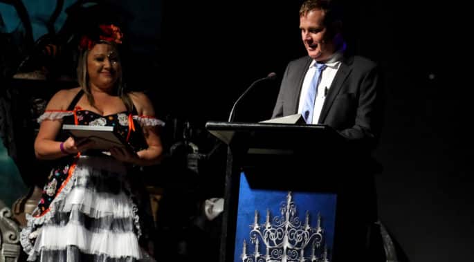 CCGT Awards night - halloween themed with presenter and award giving a spech for the winner