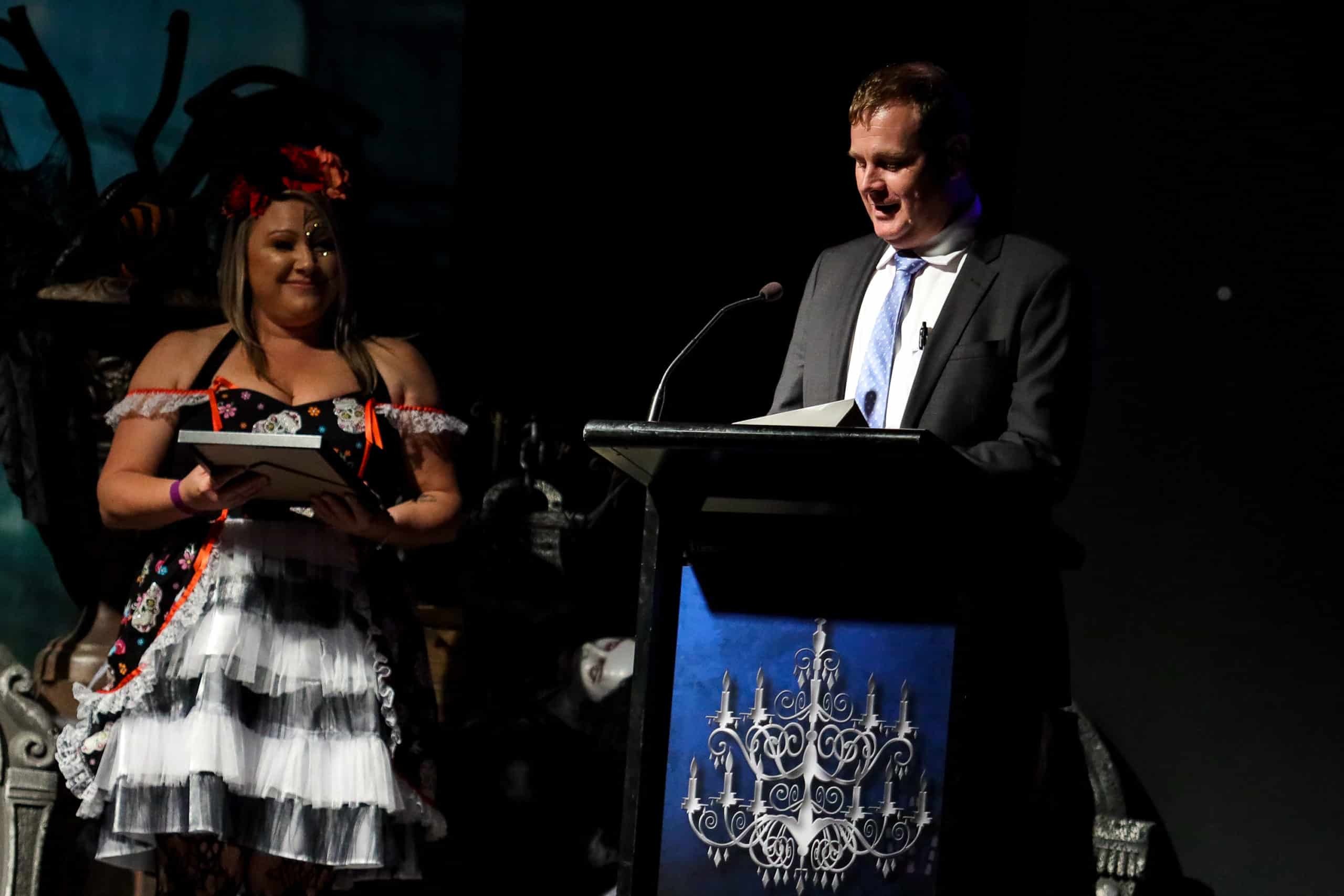 CCGT Awards night - halloween themed with presenter and award giving a spech for the winner